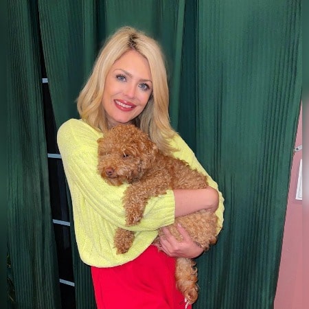 Bridgette Bjorlo holding her Dog